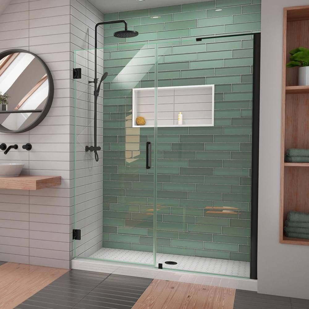 Bathroom with green tile feature wall, vanity, and glass shower
