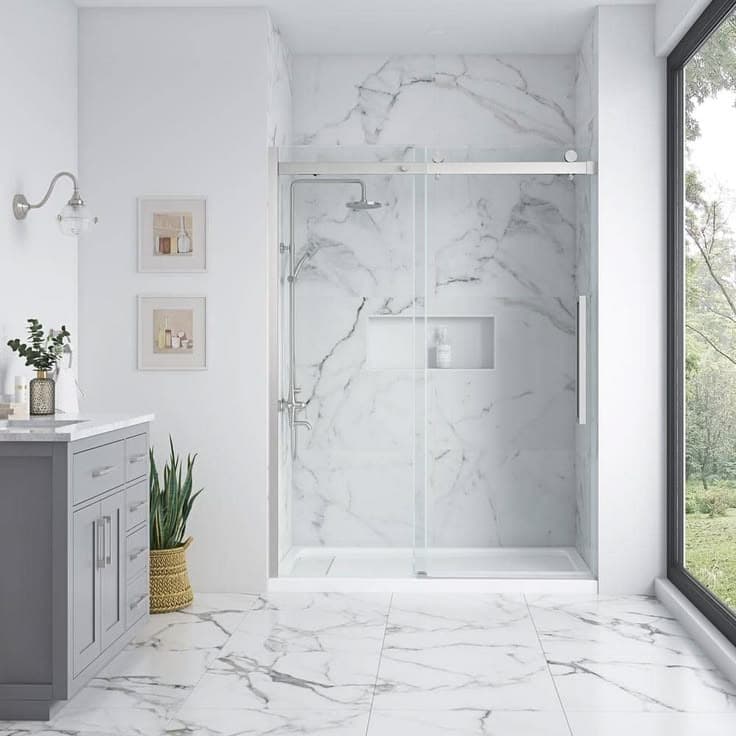 Finished bathroom with vanity, window, and glass-enclosed tiled shower
