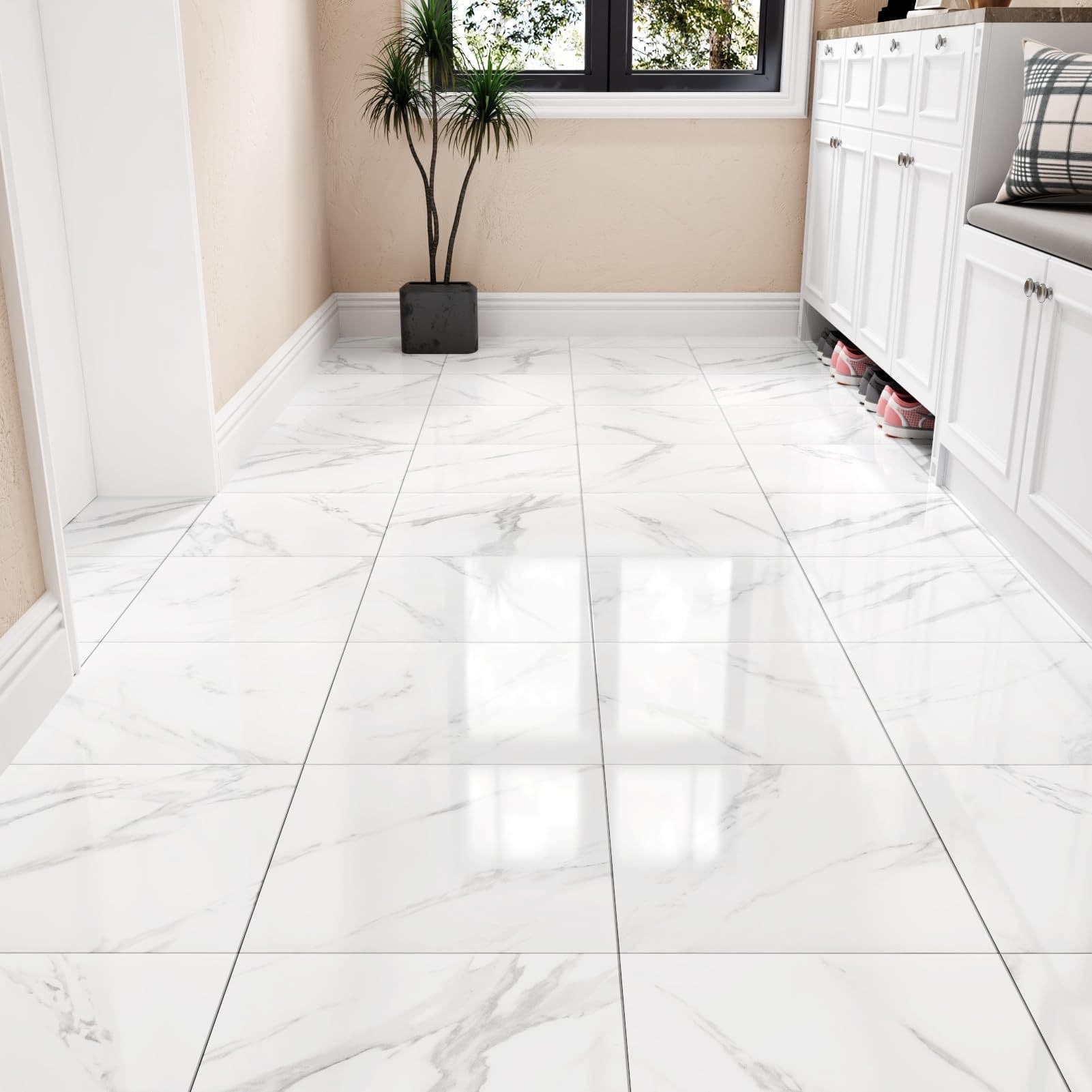 White marble-look square floor tile with gray veining in a bright room
