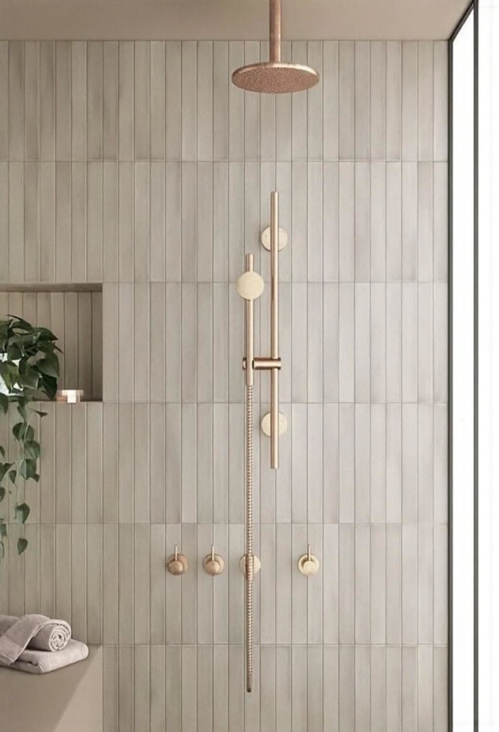 Minimal shower with vertically stacked wall tile, overhead shower and handheld controls
